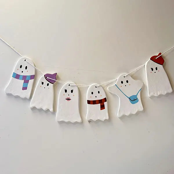 Decorative ghost-shaped banner for Halloween pottery creation