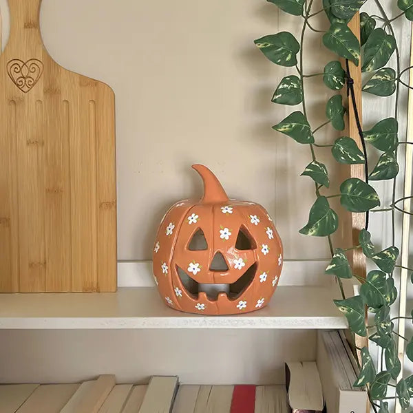 Pumpkin carving with floral design pottery Halloween creation