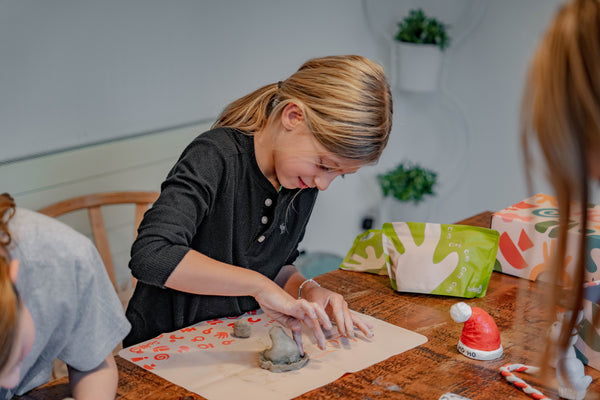A kid working on her sculpted clays with Sculpd kids pottery kit